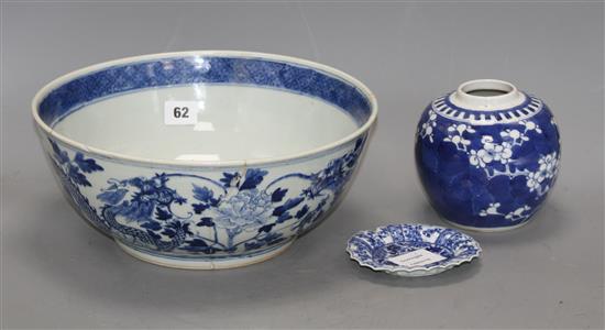 A large Chinese blue and white bowl, 29.5cm a prunus jar, height 12cm and a Kangxi blue and white fluted saucer, 11cm